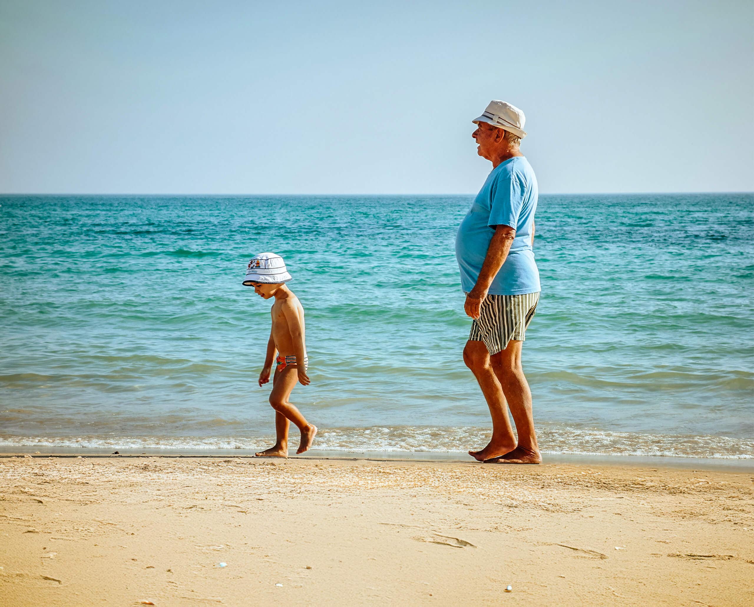 Man and child on the beach