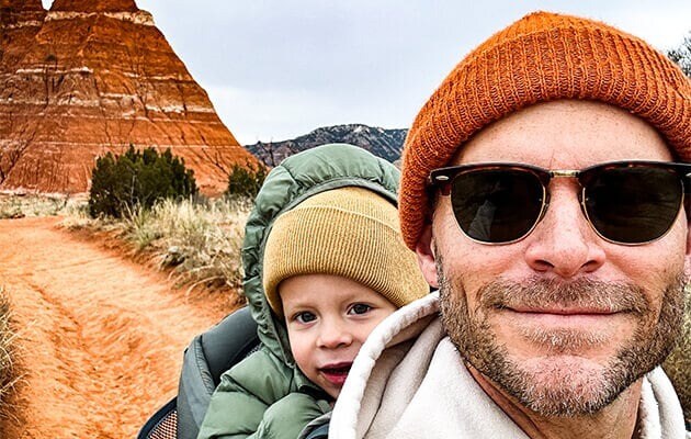 Man with a child taking a selfie